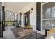 Inviting front porch with rocking chairs, a patterned rug, and charming decor accents at 595 S Antioch Rd, Mcdonough, GA 30252