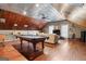 Expansive game room with pool table, wood and metal ceiling, and seating area at 595 S Antioch Rd, Mcdonough, GA 30252