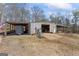 Large metal garage with covered parking and ample space for storage or workshop at 595 S Antioch Rd, Mcdonough, GA 30252