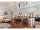 Spacious living room featuring hardwood floors, neutral decor, and abundant natural light at 595 S Antioch Rd, Mcdonough, GA 30252