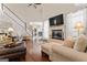 Bright living room with vaulted ceilings, fireplace, and large windows at 595 S Antioch Rd, Mcdonough, GA 30252