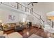 Open-concept living room with hardwood floors, lots of natural light, and a cozy atmosphere at 595 S Antioch Rd, Mcdonough, GA 30252