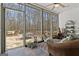 Cozy screened porch with outdoor seating, ceiling fan, and views of the backyard at 595 S Antioch Rd, Mcdonough, GA 30252