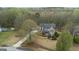 Aerial view showing a home situated on a lot with mature trees and long driveway at 308 Tussahaw Trl, Locust Grove, GA 30248