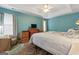 Well-lit primary bedroom suite boasting tray ceilings, natural light, and wood-look floors at 308 Tussahaw Trl, Locust Grove, GA 30248