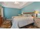 Bedroom boasts a large window and tray ceilings, showcasing ample space and lots of natural light at 308 Tussahaw Trl, Locust Grove, GA 30248