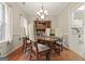 Traditional dining room with hardwood floors, chandelier, and classic wood furniture at 308 Tussahaw Trl, Locust Grove, GA 30248