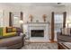 Elegant fireplace with white mantel, perfect as a focal point in the Gathering or living room at 308 Tussahaw Trl, Locust Grove, GA 30248