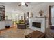 Inviting living room with fireplace, neutral tones, and open access to the kitchen area at 308 Tussahaw Trl, Locust Grove, GA 30248