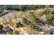 Beautiful aerial shot showcasing a neighborhood's homes along the edge of a tranquil lake at 171 Rockspray Rdg, Peachtree City, GA 30269