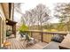 Wooden deck provides outdoor seating and backyard lake views at 171 Rockspray Rdg, Peachtree City, GA 30269