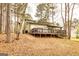Charming home featuring a spacious deck overlooking a private, tree-lined backyard for outdoor enjoyment at 171 Rockspray Rdg, Peachtree City, GA 30269