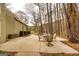 Outdoor patio features dining table, chairs, and tranquil backyard lake views at 171 Rockspray Rdg, Peachtree City, GA 30269