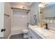 Bathroom with a white subway-tiled shower and tub combination, gray walls and floors plus a vanity with hardtop at 171 Rockspray Rdg, Peachtree City, GA 30269