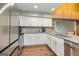 Bright kitchen features stainless steel appliances, granite countertops, updated cabinets, and hardwood floors at 171 Rockspray Rdg, Peachtree City, GA 30269