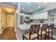 Updated kitchen features stainless steel appliances, granite countertops, a breakfast bar with seating and hardwood flooring at 171 Rockspray Rdg, Peachtree City, GA 30269