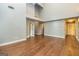 Spacious living room showcasing hardwood floors and multiple entryways at 171 Rockspray Rdg, Peachtree City, GA 30269