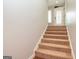 Staircase leading to a bright front door with decorative glass at 171 Rockspray Rdg, Peachtree City, GA 30269