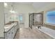 Bathroom featuring double vanity, shower, soaking tub, and tile flooring at 3393 Willow Glen Trl, Suwanee, GA 30024