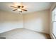 Bright bedroom with neutral carpet, ceiling fan, and a large window that offers lots of natural light at 3393 Willow Glen Trl, Suwanee, GA 30024