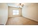 Neutral bedroom with a ceiling fan and a window that offers lots of natural light at 3393 Willow Glen Trl, Suwanee, GA 30024