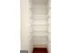Bright walk-in closet with wooden base trim and white wire shelving at 3393 Willow Glen Trl, Suwanee, GA 30024