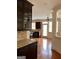 Modern kitchen features stainless steel appliances, granite countertops, and hardwood flooring at 3393 Willow Glen Trl, Suwanee, GA 30024