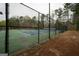 Community tennis courts with fencing and signage at 3393 Willow Glen Trl, Suwanee, GA 30024