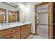 Bathroom featuring a double sink vanity with wood cabinets at 3530 Highway 81 W, Hampton, GA 30228
