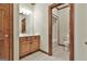 Traditional-style bathroom with wood trim, vanity, and access to a toilet and shower at 3530 Highway 81 W, Hampton, GA 30228