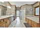 This bathroom has a dual sink vanity, bright white tile floors, and a separate tub and shower at 3530 Highway 81 W, Hampton, GA 30228