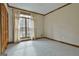 Bright bedroom featuring a window, carpet, and neutral walls for a comfortable living space at 3530 Highway 81 W, Hampton, GA 30228