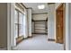 This spacious closet features built-in shelving, carpeting, and a large window with natural light at 3530 Highway 81 W, Hampton, GA 30228