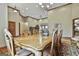 Elegant dining room featuring a large table, chandelier, and ample seating at 3530 Highway 81 W, Hampton, GA 30228