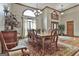 Formal dining room with a large window, chandelier, and ample seating at 3530 Highway 81 W, Hampton, GA 30228