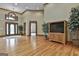 Inviting foyer with hardwood floors, a decorative rug, and a view of the living area at 3530 Highway 81 W, Hampton, GA 30228