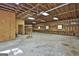 Expansive garage interior with built-in shelving, workbench, and natural light from multiple windows at 3530 Highway 81 W, Hampton, GA 30228