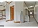 Hallway features a utility rack, and doorway views of a closet and a living room at 3530 Highway 81 W, Hampton, GA 30228