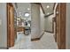 Spacious hallway with tile flooring that provides access to the kitchen and other rooms at 3530 Highway 81 W, Hampton, GA 30228