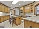 Well-appointed kitchen featuring wooden cabinets, stainless steel appliances, granite countertops, and an island at 3530 Highway 81 W, Hampton, GA 30228
