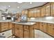 Open kitchen design with wooden cabinets, stainless steel appliances, central island and access to other areas at 3530 Highway 81 W, Hampton, GA 30228