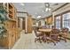 Gourmet kitchen featuring light wood cabinets, granite countertops, stainless steel appliances, and a breakfast bar at 3530 Highway 81 W, Hampton, GA 30228