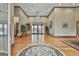 Expansive living room with tall ceilings, hardwood floors, french doors, and recessed lighting fixtures at 3530 Highway 81 W, Hampton, GA 30228