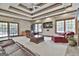 This living room features coffered ceilings, a TV, and plenty of comfortable seating at 3530 Highway 81 W, Hampton, GA 30228