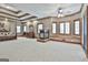 This living room has multiple windows, a fireplace, and coffered ceilings with wooden trim at 3530 Highway 81 W, Hampton, GA 30228
