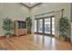 Spacious living room with hardwood floors, large windows, and natural light at 3530 Highway 81 W, Hampton, GA 30228
