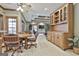 Open living space with breakfast nook, hutch, coffered ceiling and view into another living area at 3530 Highway 81 W, Hampton, GA 30228