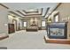 Large main bedroom boasts a trey ceiling, fireplace, and abundant natural light from multiple windows at 3530 Highway 81 W, Hampton, GA 30228