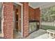 Outdoor kitchen space and half bath on back porch at 3530 Highway 81 W, Hampton, GA 30228