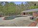 In-ground pool, pool house, lounge areas, and waterfall feature at 3530 Highway 81 W, Hampton, GA 30228